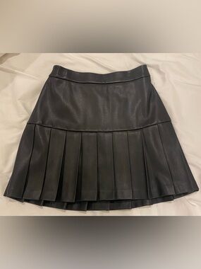 Black Pleated Faux Leather Mini Skirt. Size small.